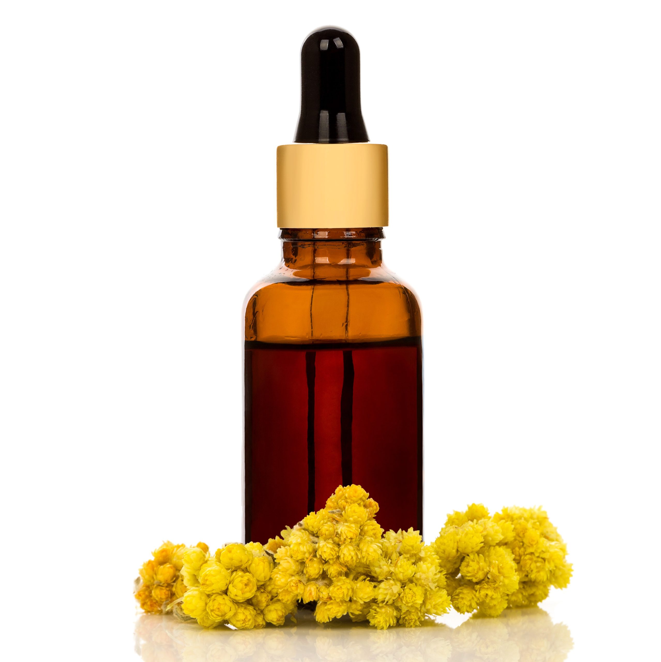 Bottle of essential skincare oil made from curry plant.